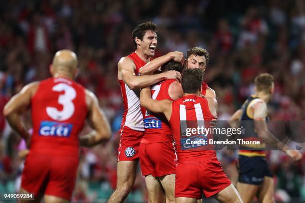 Harry Cunningham of the Swans celebrates kicking a goal with team mates during the round five AFL match between the Sydney Swans and the Adelaide...