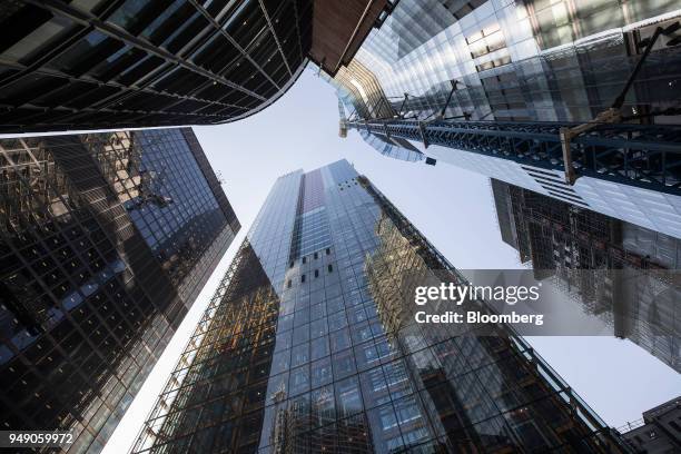 The Leadenhall building, also known as the 'Cheesegrater', center, St Helen's, the commercial skyscraper housing the headquarters of Aviva Plc, left,...