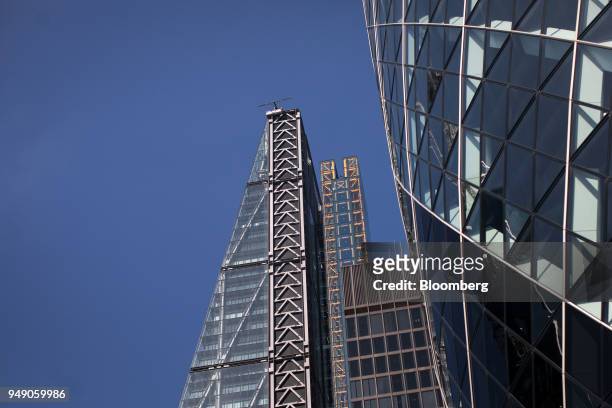 The Leadenhall building, also known as the 'Cheesegrater', left, and 30 St Mary Axe, also known as "the Gherkin," stand in the City of London, U.K.,...