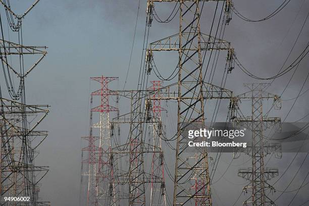 Electricity pylons stand in Kamisu City, Ibaraki Prefecture, Japan, on Friday, Dec. 14, 2007. Former U.K. Prime Minister Tony Blair urged the U.S.,...