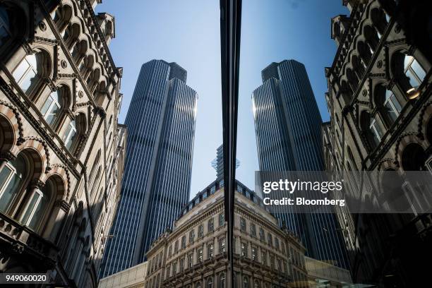 Shop window reflects The Tower 42 skyscraper in City of London, U.K., on Friday, April 20, 2018. Foreign investors are less worried about the impact...