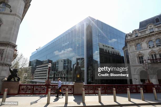 Pedestrian crosses a bridge in view of the new European headquarters of Goldman Sachs Group Inc. In London, U.K., on Friday, April 20, 2018. Foreign...