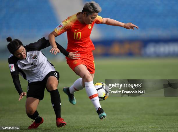 Li Ying of China and Natthakarn Chinwong of Thailand battle for the ball during the AFC Women's Asian Cup third place match between China and...