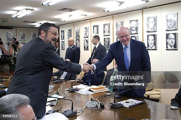 Treasury Secretary John Snow, right, shakes hands with Brazil's Finance Minister Antonio Palocci at the start of a meeting in Brasilia, Brazil...