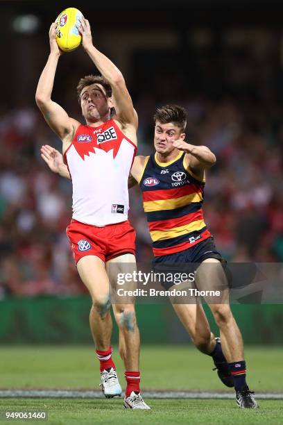 Nick Smith of the Swans contests the ball Riley Knight of the Crows during the round five AFL match between the Sydney Swans and the Adelaide Crows...
