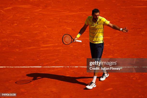 Marin Cilic of Croatia reacts in his singles match against Kei Nishikori of Japan during day six of ATP Masters Series: Monte Carlo Rolex Masters at...