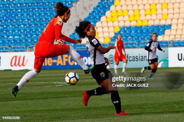 China's midfielder Yanlu Xu vies for the ball with Thailand's midfielder Kanjana Sung-Ngoen during the AFC Women's Asian Cup match for third place...