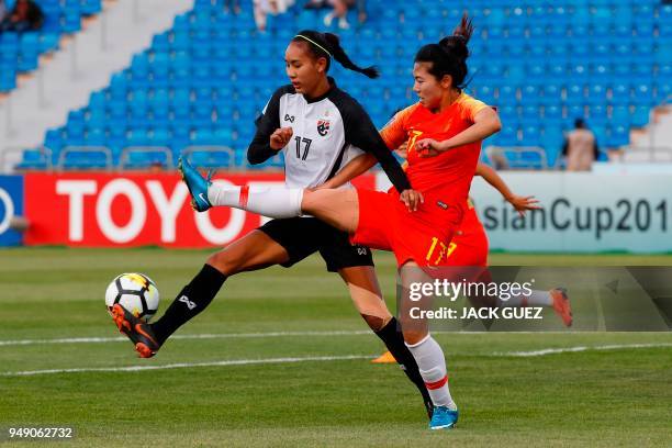 China's forward Yasha Gu vies for the ball with Thailand's forward Taneekarn Dangda during the AFC Women's Asian Cup match for third place between...