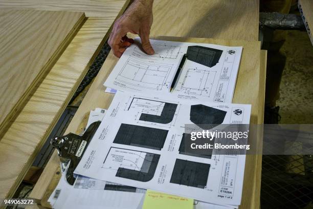 Diagrams for a sustainable furniture piece are displayed on a table at the Old Wood Co. Manufacturing facility in Asheville, North Carolina, U.S., on...