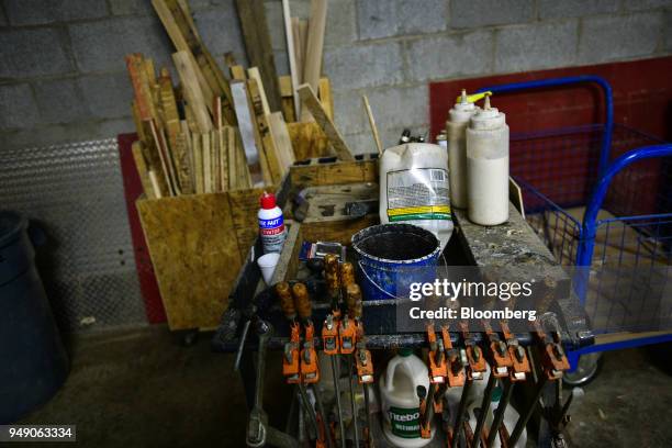 Clamps and wood glue are seen at the Old Wood Co. Sustainable furniture manufacturing facility in Asheville, North Carolina, U.S., on Wednesday,...