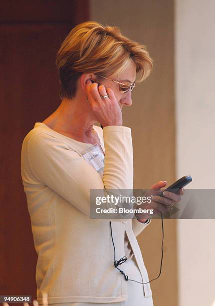 Carly Fiorina, CEO, Hewlett-Packard Company talks on a cell phone during the lunch break at the Allen & Co. Conference in Sun Valley, Idaho, July 8,...