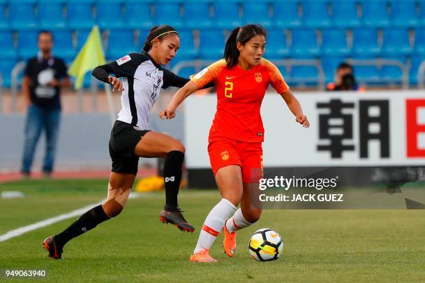 China's defender Shanshan Liu vies for the ball with Thailand's forward Taneekarn Dangda during the AFC Women's Asian Cup match for third place...