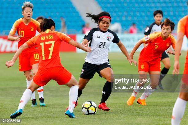 Thailand's midfielder Kanjana Sung-Ngoen vies for the ball with China's forward Yasha Gu during the AFC Women's Asian Cup match for third place...