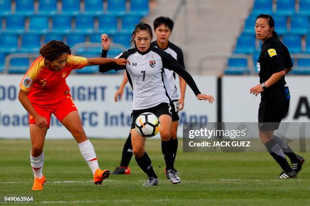 Thailand's midfielder Silawan Intamee vies for the ball with China's midfielder Shuang Wang during the AFC Women's Asian Cup match for third place...