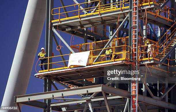Telemine Workers install cables at the shaft of the Telfer Mine in the Pilbara ...