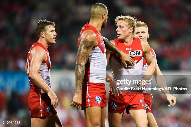 Isaac Heeney of the Swans is praised by team mates after taking a mark during the round five AFL match between the Sydney Swans and the Adelaide...