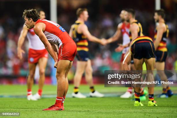 Oliver Florent of the Swans shows his dejection after defeat during the round five AFL match between the Sydney Swans and the Adelaide Crows at...