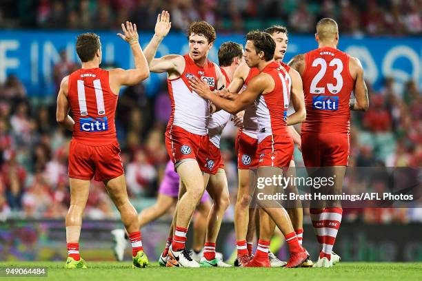 Gary Rohan of the Swans celebrates kicking a goal with team mates during the round five AFL match between the Sydney Swans and the Adelaide Crows at...