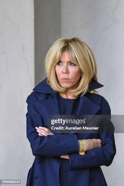 French First Lady Brigitte Macron leaves the Elysee Palace to attend the tribute to fallen police officer Xavier Jugele on April 20, 2018 in Paris,...