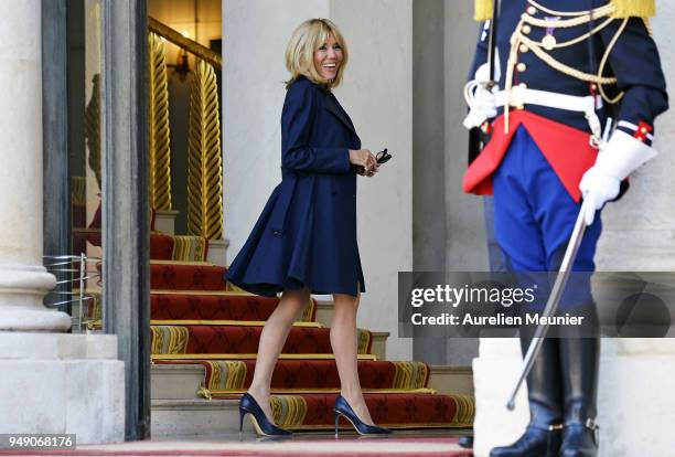 French First Lady Brigitte Macron leaves the Elysee Palace to attend the tribute to fallen police officer Xavier Jugele on April 20, 2018 in Paris,...