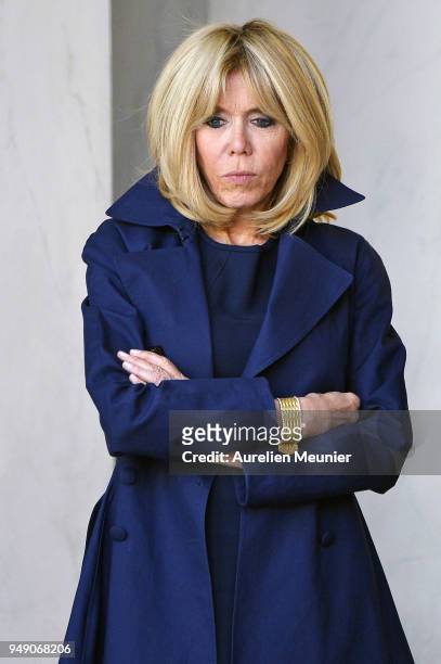 French First Lady Brigitte Macron leaves the Elysee Palace to attend the tribute to fallen police officer Xavier Jugele on April 20, 2018 in Paris,...