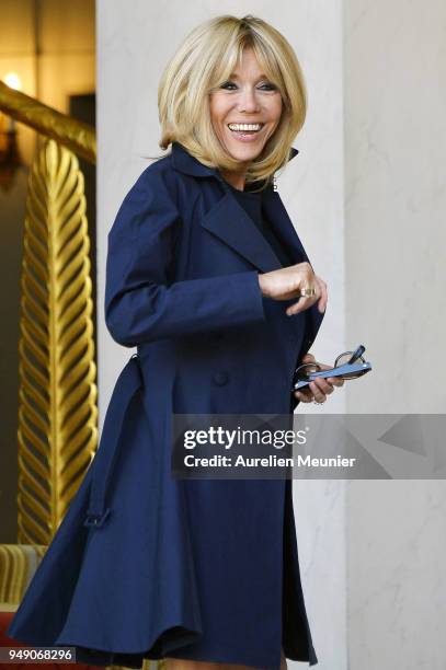 French First Lady Brigitte Macron leaves the Elysee Palace to attend the tribute to fallen police officer Xavier Jugele on April 20, 2018 in Paris,...