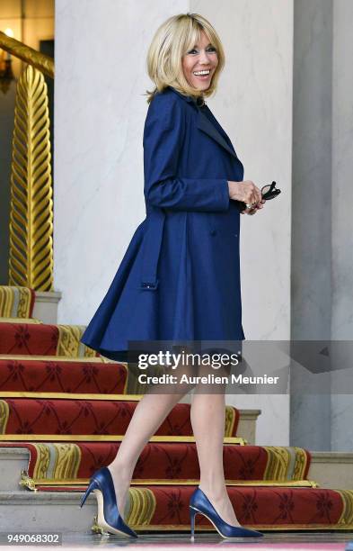 French First Lady Brigitte Macron leaves the Elysee Palace to attend the tribute to fallen police officer Xavier Jugele on April 20, 2018 in Paris,...