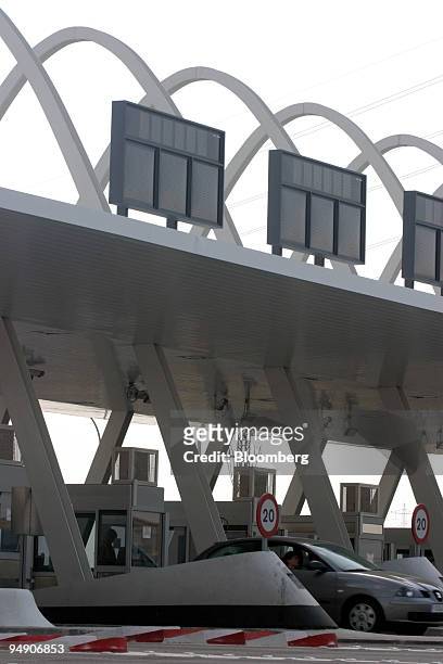 Car passes through a toll on the R-4 motorway south of Madrid, Spain, Monday, July 5, 2004. Citigroup Inc., Merrill Lynch & Co., Santander Central...