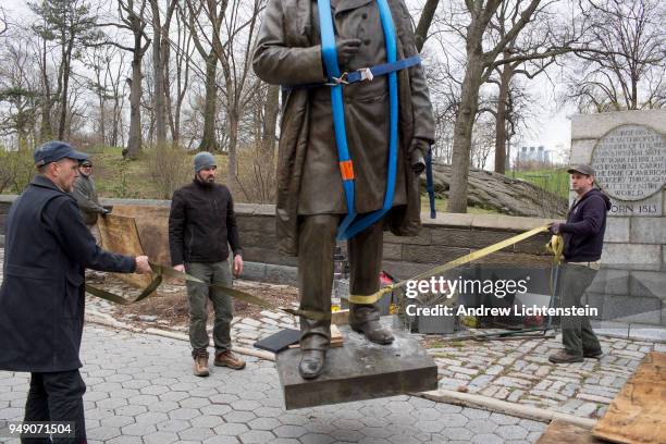 In front of a small crowd of activists and media, city workers remove a statue of J. Marion Sims, a surgeon and medical pioneer in the field of...
