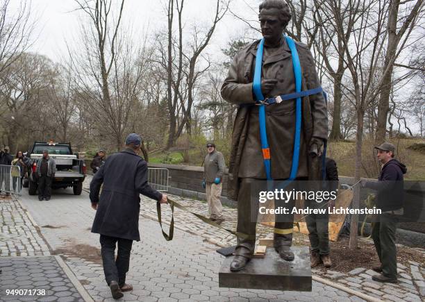 In front of a small crowd of activists and media, city workers remove a statue of J. Marion Sims, a surgeon and medical pioneer in the field of...