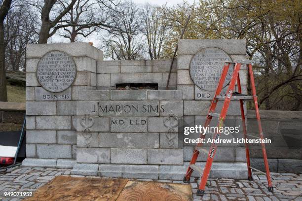 In front of a small crowd of activists and media, city workers remove a statue of J. Marion Sims, a surgeon and medical pioneer in the field of...