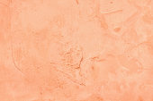 Peach color painted old cement plaster wall texture