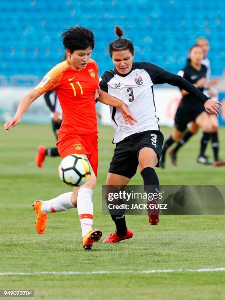 Thailand's defender Natthakarn Chinwong vies for the ball with China's forward Shanshan Wang during the AFC Women's Asian Cup match for third place...