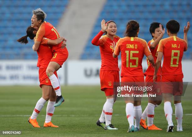 Li Ying of China celebrates scoring the opening goal during the AFC Women's Asian Cup third place match between China and Thailand at the Amman...