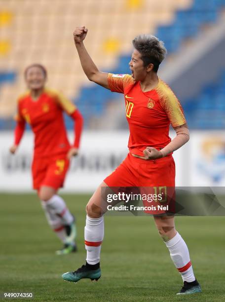 Li Ying of China celebrates scoring the opening goal during the AFC Women's Asian Cup third place match between China and Thailand at the Amman...