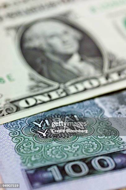 Chinese 100 Yuan note is pictured with a US one dollar bill in New York, Thursday, July 21, 2005.
