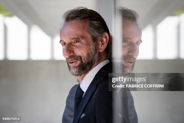 Paris Saint-Germain's assistant general manager Jean-Claude Blanc leaves after a hearing on UEFA Financial Fair Play Regulations at the House of...