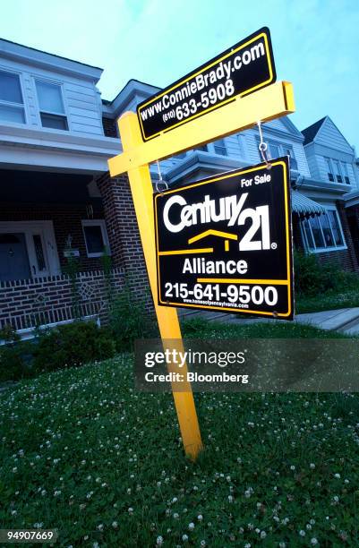 Sign on the lawn of a home is for sale is seen in Philadelphia, Pennsylvania, Friday, June 25, 2004. U.S. Sales of previously owned homes...