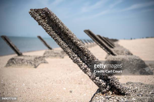 Aged anti-landing barricades are positioned on a beach facing China on the Taiwanese island of Kinmen which, at points lies only a few miles from...