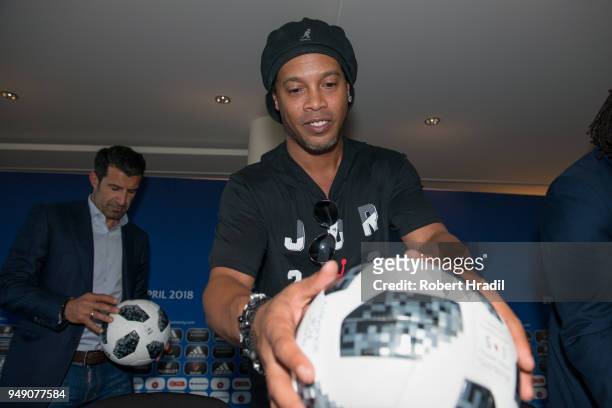 Ronaldinho, Former Brazil and Barcelona player looks and the match ball after the Press Conference of Match for Solidarity on April 20, 2018 at Grand...