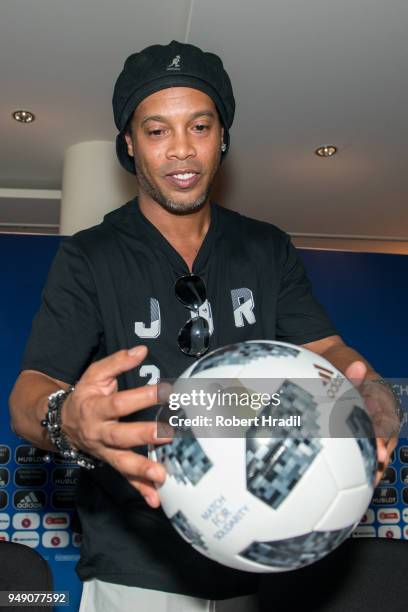 Ronaldinho, Former Brazil and Barcelona player looks and the match ball after the Press Conference of Match for Solidarity on April 20, 2018 at Grand...