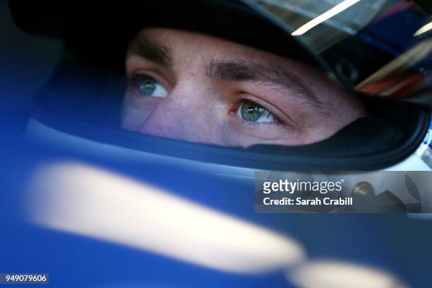 Alex Bowman, driver of the Nationwide Chevrolet, sits in his car during practice for the Monster Energy NASCAR Cup Series Toyota Owners 400 at...
