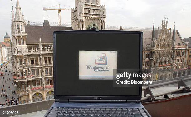 Computer screen with the logo of Windows 2000 Professional software arranged in front of the City Hall in Munich, Germany, Tuesday, June 15, 2004....