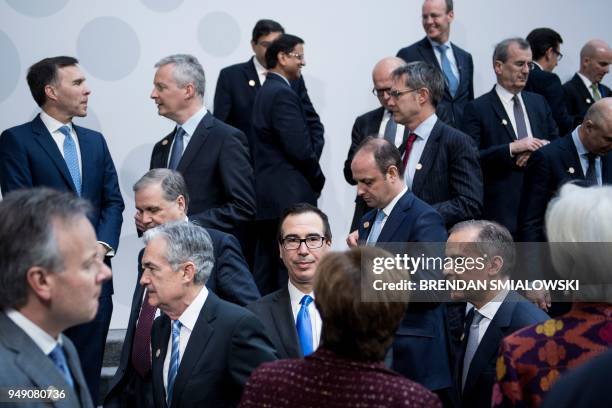 Secretary of the Treasury Steven Mnuchin stands with others after a group photo of G-20 Finance Ministers and Central Bank Governors at the 2018...