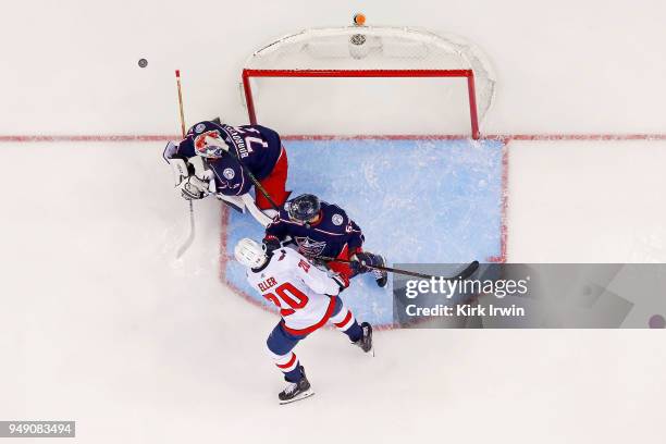 Markus Nutivaara of the Columbus Blue Jackets checks Lars Eller of the Washington Capitals as Sergei Bobrovsky of the Columbus Blue Jackets makes a...