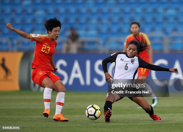 Ren Guixin of China and Pikul Khueanpet of Thailand in action during the AFC Women's Asian Cup third place match between China and Thailand at the...