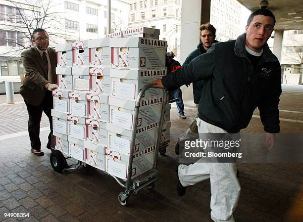 Documents pertaining to the lawsuit filed by billionaire investor Kirk Kerkorian against DaimlerChrysler Ag are brought into the federal courthouse...