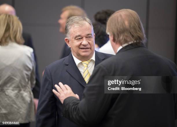 Danie van der Merwe, acting chief executive officer of Steinhoff International Holdings NV, speaks with an attendee following the companys annual...