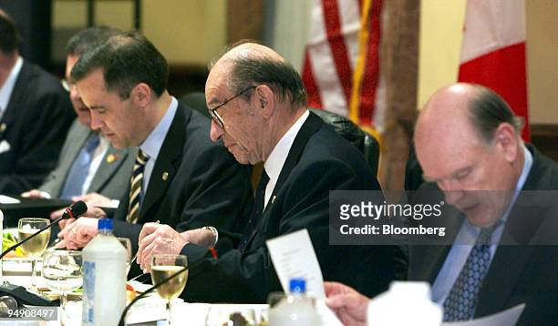Fed Chairman Alan Greenspan is flanked by U.STreasury Secretary John Snow, right, and Mark Carney, deputy governor of the Bank of Canada during...