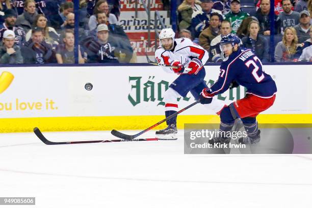 Brett Connolly of the Washington Capitals shoots the puck past the defense of Ryan Murray of the Columbus Blue Jackets in Game Three of the Eastern...